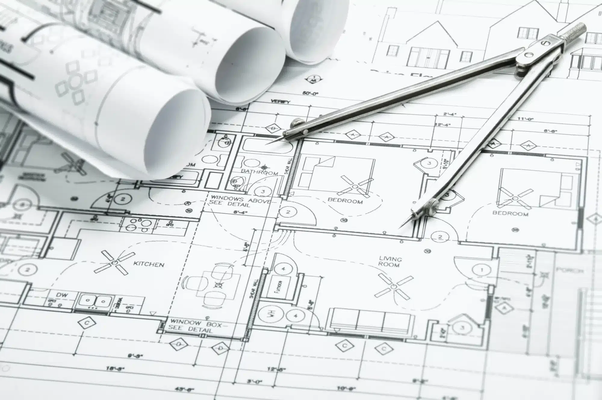 Architectural blueprints and drafting tools.